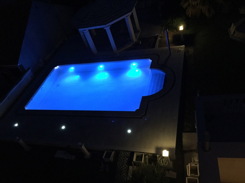 The view on the swimming pool at night. Apartments Villa Jadranka