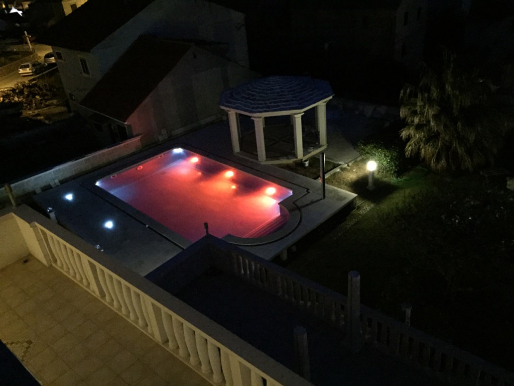 The view on the swimming pool at night. apartment Villa Jadranka